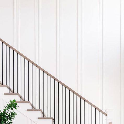 Finish trim doesn't have to be boring. Our favorite trick? Switch up patterns and styles throughout the home. This double board and batten… Board And Batten Wall Staircase, Staircase Board And Batten Ideas, Board And Batten On Stairs, Stairs Board And Batten, Board And Batten Staircase Wall, Double Board And Batten, Barndo Garage, Staircase Board And Batten, Board And Batten Stairwell