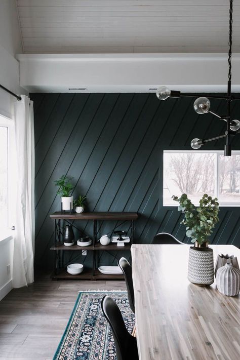 Beautiful modern dining room! Love the contemporary design in this quick renovation! As part of a weekend renovation, they painted a dark wall, added a moulding feature wall, and built a modern light wood table. The results are stunning! The dark wall colour called Midnight in NY is stunning against the light table and beautiful lighting. Can't wait to see what else gets added to this space! #minimalist #nordic #accentwall #featurewall #MDF #moulding #diningroom #darkwalls Modern Moulding, Feature Wall Living Room, Room Accent Wall, Accent Wall Designs, Accent Walls In Living Room, Green Walls, Dark Wall, Dark Walls, Decor Minimalist