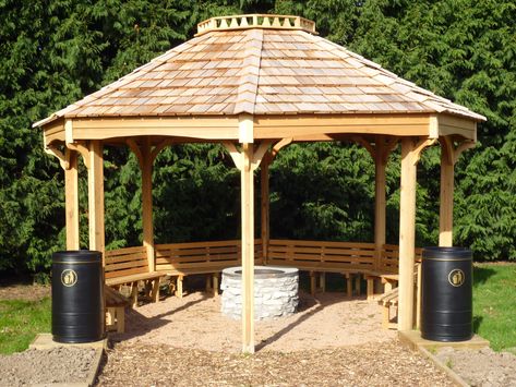 This unique fire pit shelter and outdoor classroom combines two functions – firstly it can act both as a shelter for your forest school or outdoor learning area plus you can use it as an outdoor classroom and teaching facility. Click to see more features. Fire Pit Shelter Outdoor Areas, Fire Pit Shelter, Diy Shelter Outdoor, Outdoor Structures Shelters, Outdoor Shelter Ideas Woods, Shelter Design Architecture Outdoor, Outdoor Classroom Pavilion, Forest School Shelter, College Garden