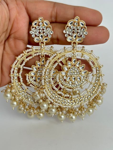 Gold Bollywood Stone Kundan Earrings Indian long Earrings/pearl Earring/Pakistani Earrings/Statement Earrings/Long chandelier/bridal earrings Length 3.5 inches Width 2.5 inches Arrives in a gift box Color, shades, and texture displayed may slightly vary from the actual product due to digital image limitations. We request that you to consider these minor variations. Please expect the possibility of some slight imperfections when buying handmade jewelry. If you have any questions, please contact u Chaandbali Kundan, Punjabi Jewellery, Pakistani Earrings, Promise Jewelry, Indian Accessories, Bridal Earring, Long Chandelier, Bridal Earrings Chandelier, Fancy Jewellery Designs