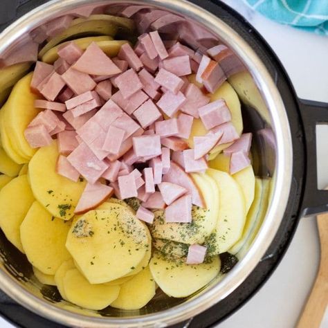 Instant Pot Scalloped Potatoes and Ham can be an incredible comfort food dinner or savory side dish. Cheesy scalloped potatoes are one of our favorites. Give this pressure cooker scalloped potatoes recipe a try. Monterey Jack, thick creamy sauce, sliced potatoes, and ham in every bite. #cheesy #scalloped #potatoes #dinner #leftoverham #instantpot #pressurecooker Instapot Scalloped Potato Recipes, Instant Pot Potatoes And Ham, Ham And Potato Instant Pot Recipes, Instant Pot Recipes Ham, Instapot Scalloped Potatoes And Ham Easy, Instant Pot Ham And Scalloped Potatoes, Pressure Cooker Casserole Recipes, Pressure Cooker Ham Recipes, Instant Pot Ham Recipes Easy