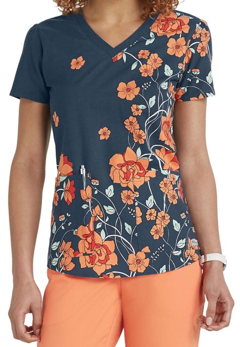 The exquisite Sweet Nouveau print scrub top from the popular Grey's Anatomy collection is perfect for the season! In addition to the vibrant floral print, this top includes two roomy pockets to hold your accessories plus a shirred back yoke and side slits to complete the look. Medical Scrubs Fashion, Veterinary Scrubs, Fun Scrubs, Healthcare Uniforms, Stylish Scrubs, Scrub Style, Cute Scrubs, Nursing Scrubs, Greys Anatomy Scrubs