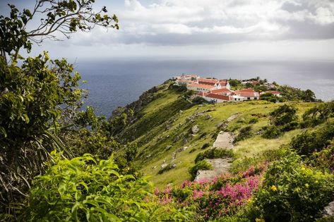 The island of Saba is a tiny spot of emerald in the Caribbean sea and, while it is often overlooked by sun-loving tourists, it’s a haven for food enthusiasts, outdoor adventurers, and sea-loving explorers. Here are some of the best activities on Saba’s mountainous terrain and in its clear ocean depths. Clear Ocean, Water Island, Caribbean Culture, Beach Honeymoon, Caribbean Beaches, Caribbean Travel, Island Getaway, Cruise Ships, Beach Paradise