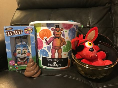 FNAF Easter basket we made for our son. We printed characters out on sticker paper and applied to chocolate bunny and basket. Chocolate Bunny, Easter Basket, Gift Basket, Easter Baskets, Gift Baskets, Sticker Paper, Baskets, Hello Kitty, Easter