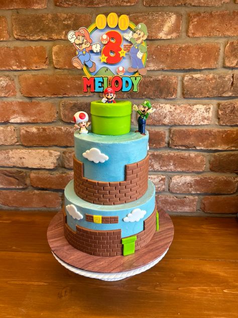 Chocolate Fudge sponge with chocolate Swiss Meringue Buttercream covered in blue vanilla Buttercream and finished with a Mario theme. #mario #supermariobros #callebaut #cake #chocolatecake #luigi #happybirthdaywishes Chocolate Swiss Meringue Buttercream, 2 Tier Cake, Super Mario Birthday, Swiss Meringue Buttercream, Mario Birthday, Vanilla Buttercream, Chocolate Fudge, Super Mario Bros, Mario Bros