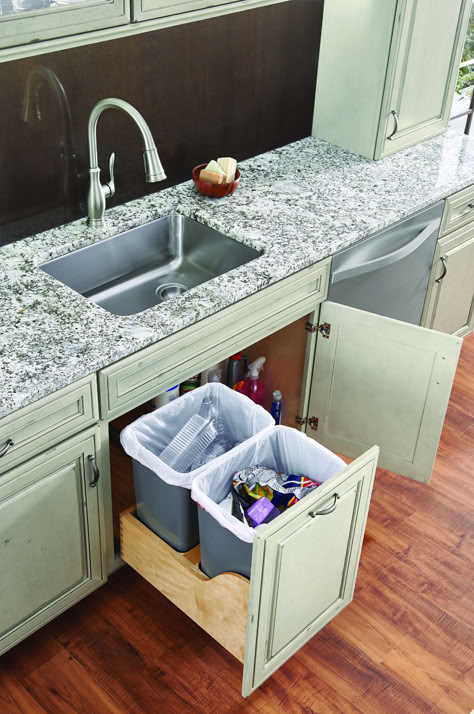 With the sink cabinet being perhaps one of the largest cabinets in your kitchen, why not maximize your storage space with a pullout drawer, tilt down tray, trash pullout or door mounted storage shelf? Desain Pantry Dapur, Kitchen Sink Cabinet, Under Kitchen Sink, Acnh Basement, Modern Kitchen Sinks, Kitchen Sink Organization, Desain Pantry, Kitchen Sink Storage, Kitchen Sink Design