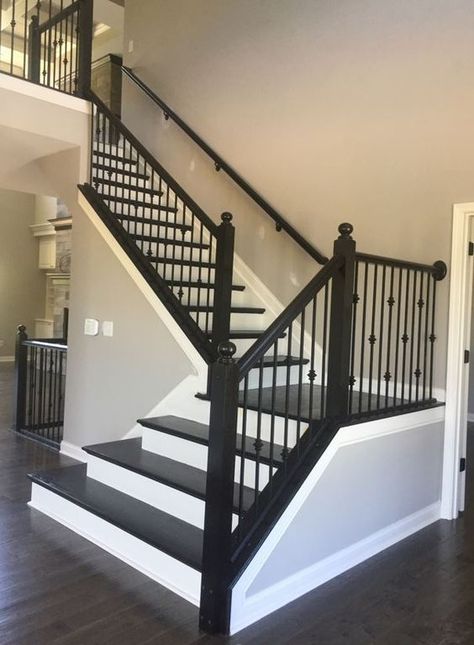 Black Banister With Iron Spindles, Banister Spindles Ideas, Stair Casing Ideas, Espresso Stained Stairs, Wrought Iron Spindles On Stairs, Black And White Staircase, Wrought Iron Stair Spindles, Wrought Iron Spindles, Iron Spindles