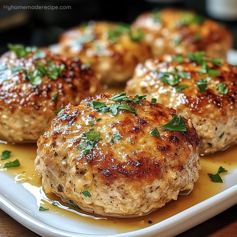 These Garlic Parmesan Chicken Meatloaves are tender, flavorful, and easy to make, featuring a savory blend of garlic, Parmesan, and herbs. Garlic Parmesan Chicken Mini Meatloaves, Chicken Parmesan Patties, Garlic Parmesan Turkey Meatballs, Lipton Recipe Secrets Savory Herb With Garlic, Garlic Parmesan Chicken Meatballs, Garlic Parm Chicken Meatloaves, Garlic Parmesan Meatloaf, Chicken Loaf Recipe, Garlic Parmesan Chicken Meatloaves