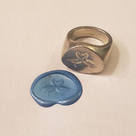 This signet ring is cast in lead-free pewter. The ring size when cast is 7.25 . The sealing image is a couple of geese kissing.       This is part of a series of signet rings I am making cast from lead-free pewter. Each master ring is hand sculpted to give a unique, rustic style, multi-dimensional relief image when used as a stamp to seal, with sealing wax. Couple Signet Rings, Signet Ring Wax Seal, Unique Bezel Settings, Signet Wedding Ring, Lost Wax Casting Rings, Wax Seal Ring, Wax Jewelry, Jewelry Mood Board, Gift For Partner