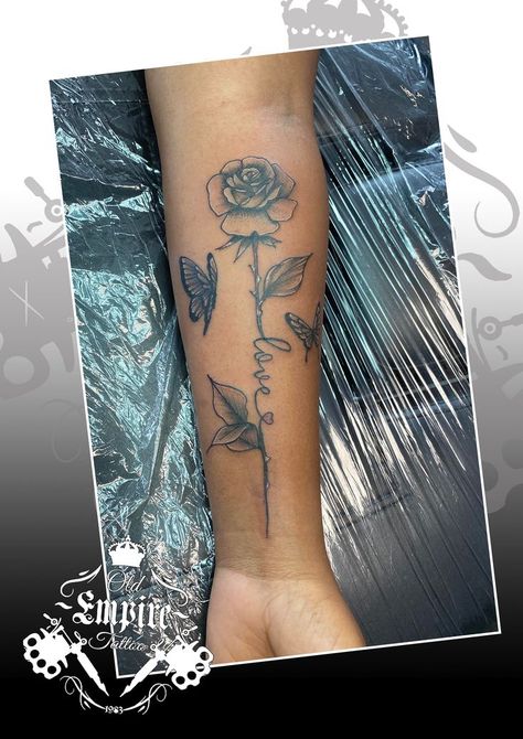 Beautiful Rose stem script butterfly design for our clients arm 🖤🥀 #rosetattoo #scripttattoo #butterflytattoo #oldempiretattoostudio #salfordoriginal #LittleHulton #manchester #blackandgreyrealism #blackandgreyink #inkideas #tattooartist #tattoodesign #girlswithink #weloveink Rose With Stem, Empire Tattoo, Script Tattoo, Tattoo Script, Rose Stem, Beautiful Rose, Rose Tattoo, Butterfly Design, Butterfly Tattoo