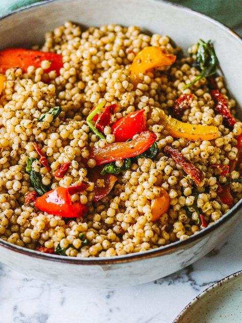 Pearl couscous with grilled vegetables and green pesto<p>This is one of my favorite recipes with pearl couscous. This delicious and healthy meal is wonderfully easy to make. Pearl couscous with green pesto is a classic combination, so guaranteed to be a success. I used paprika and spinach, but you can vary this with the vegetables you have on hand. A real winner in the summer at a BBQ or to take with you on the road!</p> Pearl Couscous Recipes, 2024 Meals, 2025 Moodboard, Pearl Couscous, Green Pesto, Couscous Recipes, My Favorite Recipes, Veggie Pizza, Food Photography Inspiration