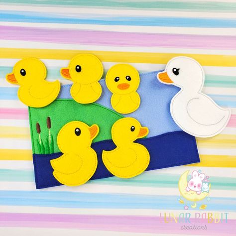 Your little one will have fun reenacting the Five Little Ducks nursery rhyme through these felt dolls. This storyboard will reinforce a variety of skills such as counting to five, addition, subtraction, backward counting, and rhyming. Specifications: storyboard measures 6x10 inches 5 baby ducks and 1 white momma duck the back pocket allows you to store all the pieces when not in use caretakers should always watch small children to avoid pieces being placed in the mouth pieces are made from Ameri Five Little Ducks Activities, Backward Counting, Barnyard Vbs, Ducks Nursery, 5 Little Ducks, Flannel Stories, Kindergarten Calendar, Five Little Ducks, Duck Stuff