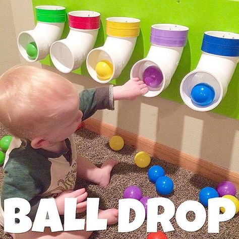 Ball Drop  I saw this on Pinterest and when we put together a playroom for boy for Christmas, my husband helped me make this ball drop using pvc pipe. I put different colored tape around the top of each to match the colors of the ball pit balls we have, so that we can eventually use this to work on identifying colors too! #easybabyactivities #activitiesforbabies #playwithbabies Ball Pit Balls, Daycare Ideas, Playroom Ideas, Ball Drop, Toddler Play, Baby Diy, Toddler Fun, Baby Sensory, Toddler Learning