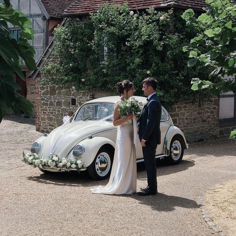 Love this picture of our newlyweds at their wedding in Grittenham Barn, Petworth. She opted for white ribbons and bows with our handmade white rose garland. Vw Beetle Couple Photoshoot, Vw Beetle Wedding Car, Sofas Wedding, Beetle Photoshoot, Volkswagen Wedding, Beetle Wedding Car, White Rose Garland, Wedding Duties, Vw Wedding