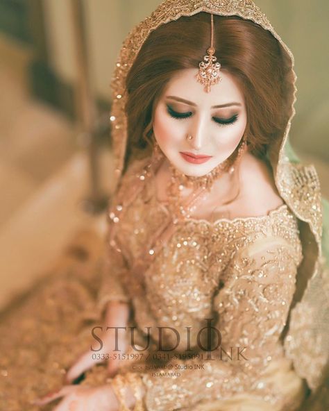 Brides / Dulhan from pakistan and india mostly on their Valima Nikah or celeberate this ceremony before their wedding day by wearing these bridal dresses. Most of these contain colors of Golden, White, Offwhite with minimum amount of makeup.  #receptiondress #goldendress #pakistanbridals #pakistancouture #valimadress #nikahdress #engagementdress Nikah Dress, Desi Bride, Golden Dress, Pakistani Bridal Dresses, Engagement Dresses, Bridal Shoot, Bride Look, Reception Dress, Bride Style