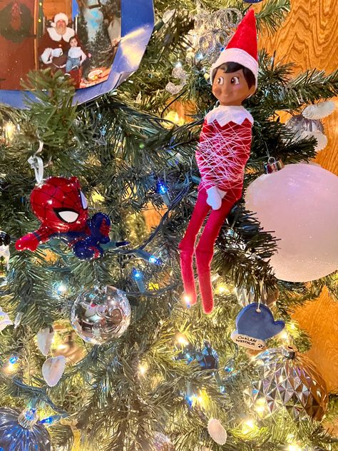 Spider-Man figurine in front of elf. Elf is wrapped in thread to look like spiderwebs. Elf On The Shelf Idea, Easy Elf On The Shelf, Easy Elf, Christmas Games, The Elf, On The Shelf, Elf On The Shelf, Elf, Christmas