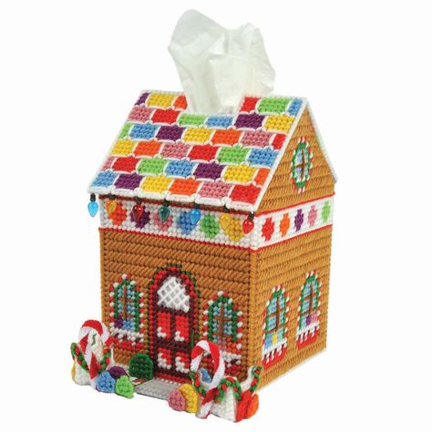 This Christmas plastic canvas tissue box cover is shaped like a gingerbread house with a rainbow roof and embellished with candy canes and gumdrops accents. Lightbulb beads along the roof add an extra-special touch to this treat of a design that can be displayed year after year! The kit includes 7-mesh plastic canvas, acrylic yarn, needle, and complete instructions to stitch the 5 x 8 x 6" (12.7 x 20.3 x 15.2cm) tissue box cover. Imported.  This plastic canvas kit includes 7-mesh plastic canvas, Beads Needle, Christmas Plastic Canvas, Plastic Canvas Tissue Box Cover, Shingle Roof, Christmas Houses, Plastic Mesh, Plastic Canvas Tissue Boxes, Plastic Canvas Christmas, Chenille Stems