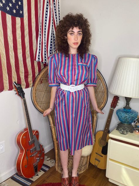 1980s dress by "Betsy's Things" in a size medium / large. The actual tag doesn't have a size on it but this is my guess of sizing!  Below are measurements: pit to pit: 20 inches across Waist: 16.5 inches across (when stretched 19.5 inches across) it has an elastic stretchy waistband!  Length: 42 inches long You need this dress for the most stylish 80's look! The colors are so wonderful. I styled it with a white chunky belt and some heels! I'm a size small but honestly it looks great on smaller s 80s Women Outfits, 80s Aesthetic Outfits, 80’s Outfits, 1980s Outfits, 80s Inspired Outfits, 1980s Fashion Women, 1980’s Fashion, Chunky Belt, 80s Look