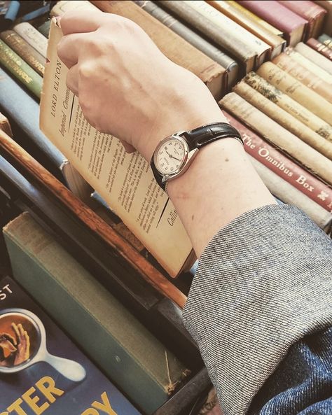 Hand grabbing dark academia book old book Aesthetic Hand Watch, Aesthetic Wrist Watch, Dark Academia Watch, Wrist Watch Aesthetic, Wristwatch Aesthetic, Compass Watch, Online Shopping Sites Clothes, Money Clothes, Pretty Watches