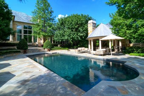 This spacious pool offers a popular feature called a tanning ledge or a sun deck area and creates a shallow area that can be used for kids, pets and to allow furniture to be placed in the water. Typically the ledge is just flat and does not have any slope on it. Diamond Brite Pool Colors, Outdoor Cabana, Pool Finishes, Pool Shapes, Pool Colors, Rectangular Pool, Luxury Estate, Pool Photos, Luxury Pool