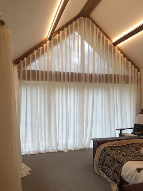 A great idea for dressing a large apex window.  Soft voile curtains with a cartridge pleat heading. By Clare Laughland Interiors Triangle Window Coverings, Apex Curtains, Large Window Curtains, Apex Window, Triangle Window, Barn Window, Curtains Bed, Gable Window, Stylish Curtains