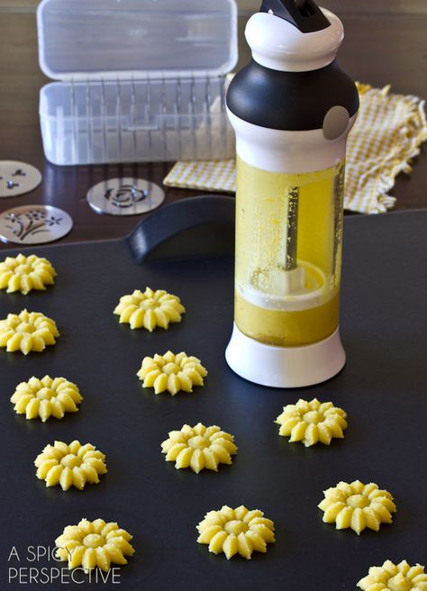 Lemon Pressed Cookies Recipe with Lemon Cream Filling | ASpicyPerspective.com #cookies #lemon #cookies #kidfriendly Pressed Cookies, Lemon Cream Filling, Press Cookies, Cookie Press Recipes, Curd Cookies, Lemon Cookies Easy, Lemon Press, Cookies Lemon, Spritz Cookie Recipe