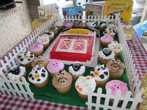 This was the birthday cake for my two year olds farm animal theme party. The base my husband made by covering plywood with felt and adding white fencing from Hobby Lobby.  We added a protective layer of felt that we removed after the cake and it now serves as a "pasture" for her to play with her farm animal toys. Barn Cakes For Kids, Old Macdonald Birthday Cake, Farm Animal Birthday Cake, Barnyard Birthday Cake, Farmyard Birthday Party, Old Macdonald Birthday, Farm Birthday Cake, Barnyard Cake, Barn Cake