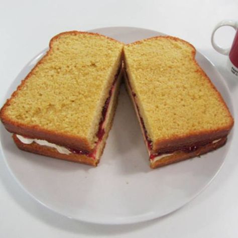 Cake baker:Frances Quinn "I created a Giant Jam Sandwich cake for my friend Hannah's birthday using the simple vanilla sponge recipe. Hannah's favorite cake is normally a Victoria Sponge, so I decided to give the Simple Vanilla Cake a twist by turning it into the shape of a giant sandwich! The sponge itself was still filled with cream and jam and could be enjoyed as either an open or shut cakewich. " Giant Sandwich, Marmalade Sandwich, Simple Vanilla Cake, Frances Quinn, Fondant Leaves, Jubilee Cake, Jam Sandwich, Sponge Recipe, Healthy Brunch Recipes