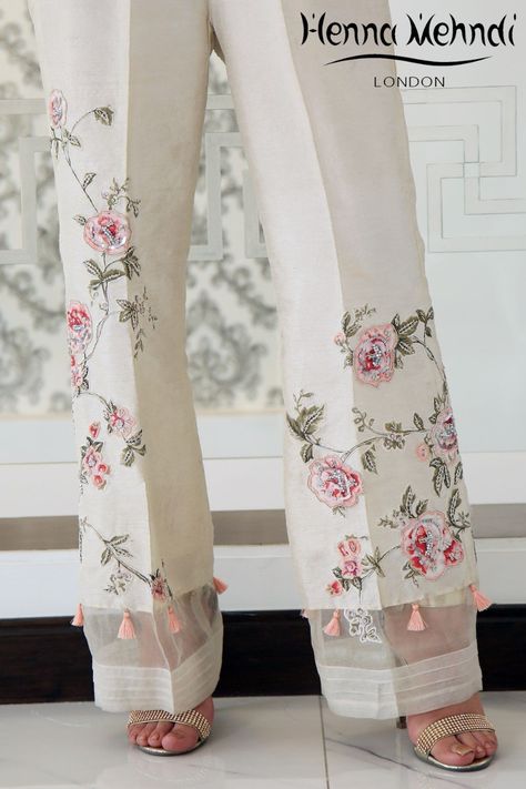 Ivory raw silk boot cut trousers with pink diamante embroidery and embellishment with tassel accessories.  Please note these are trousers only. Please note deli Tassel Accessories, Women Trousers Design, Celana Fashion, Salwar Pants, Pakistani Clothes Online, Womens Pants Design, Salwar Designs, Salwar Kamiz, Henna Mehndi