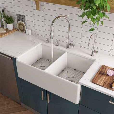 This ALFI Brand apron front/farmhouse fireclay kitchen sink is designed to complement your cooking space and make it even more functional. With its large double equal bowl this white sink will help you in all your tasks in the kitchen and will facilitate the cleaning of the dishes. The modern design and smooth surfaces create a flawless look for years to come. It measures 32.75-in (L) x 19.88-in (W) and comes with 1-year limited warranty.Bottom width: 32 1/2-in; Top width: 32 3/4-in3 1/2-in rear center drainWall thickness: 3/4-inNon reversibleBowl dimensions: 15 1/8-in x 18 1/8-in x 9 1/8-inDue to the organic nature of the fireclay material, dimensions may vary by 1/8-in of 1-inThis sink can be installed in 3 different ways: Undermount, topmount and flushmountThis sink is constructed of so Farm Sinks, Double Basin Kitchen Sink, Traditional Faucet, Single Hole Kitchen Faucet, Farmhouse Kitchen Sink, Apron Sink Kitchen, Apron Sink, Sink Grid, Kitchen Fun