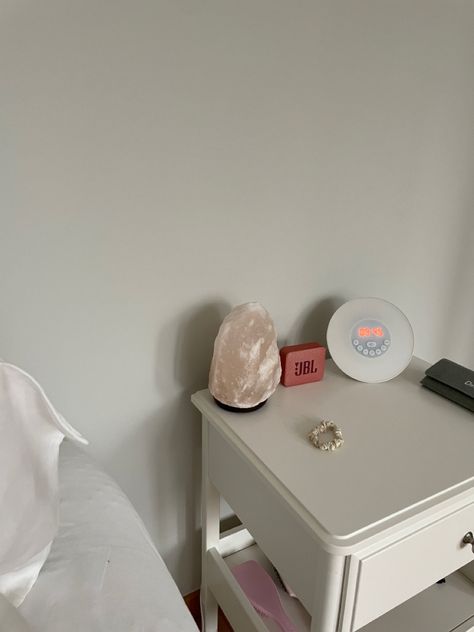 nightstand, aesthetic, salt lamp, rose, clean girl, it girl, inspo, inspiration, bedroom, white, ikea, jbl White Salt Lamp Aesthetic, White Nightstand Aesthetic, Aesthetic Salt Lamp, Salt Lamp Aesthetic, Girl Nightstand, Nightstand Aesthetic, Lamp Aesthetic, Bedroom White, White Nightstand