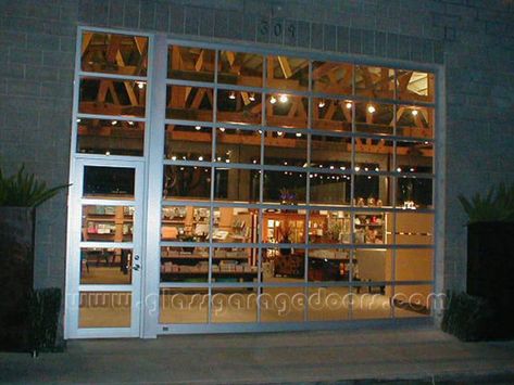 Go to our website to see more glass garage doors and storefront combos in our gallary Garage Boutique, Glass Garage, Commercial Garage Doors, Garage Renovation, Glass Garage Door, Barn Renovation, Roll Up Doors, Overhead Door, Brick Facade