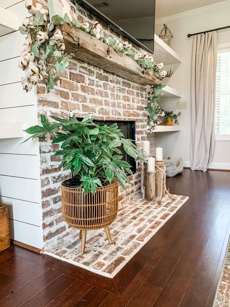 Old Mantle Decor, Old Brick Fireplace Makeover Fire Places, Fireplace With Plants Decor, Fireplace Decor With Plants, Brick Fireplace With Floating Mantle, White Distressed Fireplace, Cream Wash Brick Fireplace, Fireplace Decor Plants, Brick Wall Fireplace Decor