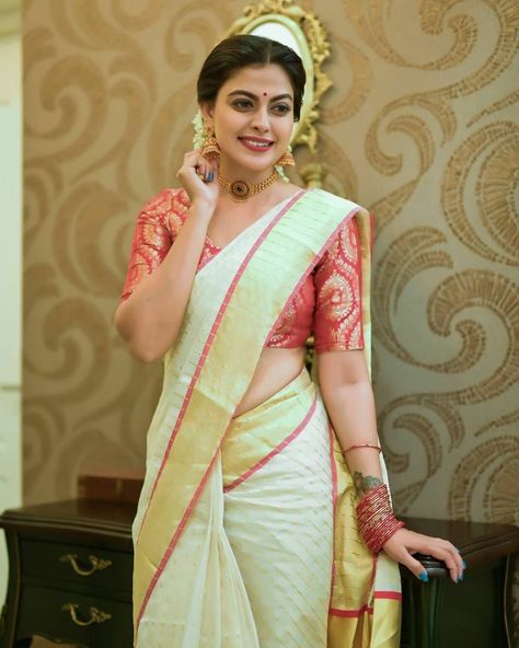 Anusree Nair looks divine in an ivory set saree with red border! Anusree Nair, Kerala Piravi, Kerala Saree Blouse, Kerala Saree Blouse Designs, Onam Saree, Kerala Saree, Blouse Design Images, Set Saree, Indian Saree Blouse