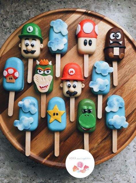 Super Mario Bros Cakesicles, Mario Cakesicles, Super Mario Cakesicles, Mario Bros Cake Pops, Super Mario Cake Pops, Mario Cake Pops, Mario Kart Party, Mario Bros Birthday Party Ideas, Donut Decorating Ideas