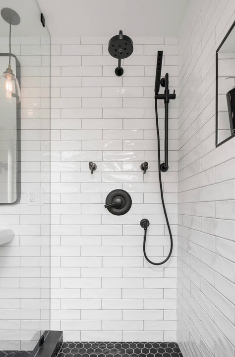 White undulating subway tile shower with black Brizo fixtures Shower Tile Black Grout, Shower Black Fixtures, Shower Tile Black, Blue And White Bathroom Ideas, White Subway Tile Shower, Black Bathroom Fixtures, Blue Shower Tile, Black Fixtures, Master Suite Bathroom