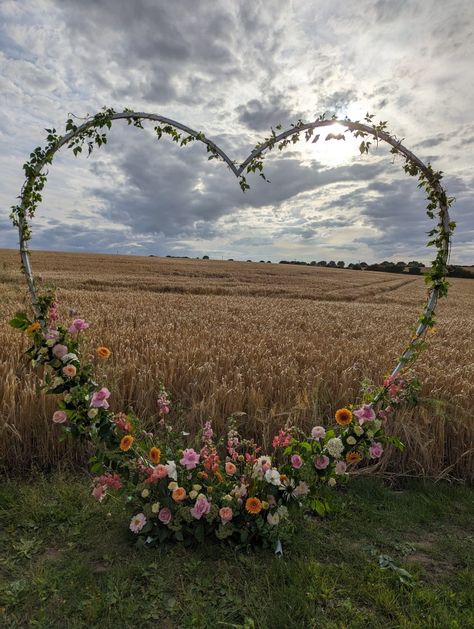 Floral wedding heart arch Heart Shaped Arch For Wedding, Heart Shape Wedding Arch, Heart Shape Decorations Wedding Ideas, Backyard Floral Wedding, Wedding Arch Heart, Wedding Arch Shapes, Heart Shaped Wedding Arch, Heart Arch Proposal, Heart Arch Wedding Decoration