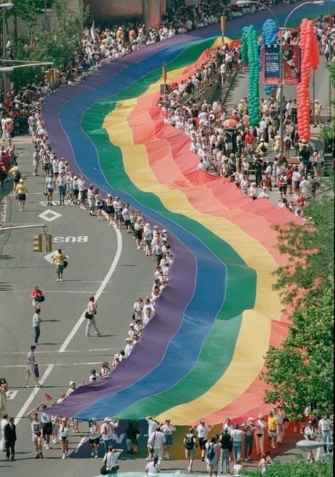 In 1994, Gilbert Baker created a mile-long rainbow flag for the 25th anniversary of the Stonewall Riots. Photographed by Eric Miller. Stonewall Riots, Gay Pride Parade, Lgbtq Funny, Gay Aesthetic, Lgbt Love, Lgbt Art, Rainbow Aesthetic, Pride Parade, Rainbow Flag