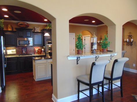 Arched openings accentuate the beautiful kitchen and breakfast bar in Ole South's Benevento East Model Home.  www.olesouth.com/Benevento-east Small Kitchen Arch Design Modern, Arched Opening Kitchen, Kitchen Arch Design Modern, Kitchen Island With Columns, Arch Kitchen, Kitchen Cabinet Door Styles, Dining Room Furniture Design, Indian House Plans, Dream Kitchens Design