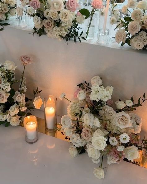 DeLight Floral (Toronto) on Instagram: "A classic, dreamy, blush wedding ✨ We repurposed all the deconstructed ceremony florals {previous post} to embellish the head table and it was 😍🤩. We are finding a lot of our couples are gravitating towards this option 🫶🏼

We had an hour to flip the entire reception room as the room was used as the ceremony space. It’s always such a rush and scramble but soooo rewarding when it all comes together! 

Planning @blushingaura 
Photo @lane.ave.studio 
Video @norrisfilms 
Venue @omnikingedward 
Tabletop @tabletalesinc 
Stationary @eventthingsandco 
 

.
.
.
Wedding
Wedding Flowers
Floral Design
Bride
Wedding Inspiration
Candles" Ceremony Florals, Reception Room, Candle Inspiration, Head Table, Blush Wedding, Reception Rooms, Bride Wedding, Wedding Bride, Instagram A