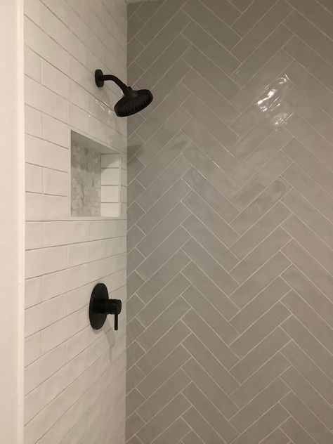 Herringbone On One Shower Wall, Black Herringbone Shower Floor, Herringbone And Subway Tile Bathroom, Small Bathroom Herringbone Tile, Bathroom Chevron Tile, Dark Shower Floor Light Walls, Herringbone Backsplash Bathroom Shower Walls, Tub With Herringbone Tile Walls, Lake House Shower Tile Ideas