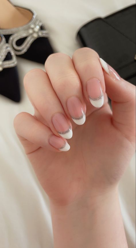 Bridal Gel Nails Wedding French Tips, French Tip White And Silver, Cute French Nails Ideas With Glitter, Glitter Lined French Tip Nails, Bride's Nails French, French Manicure Silver Line, French Tip With Silver Accent, Almond French Tip Nails With Silver Line, Almond French Tip Nails With Silver