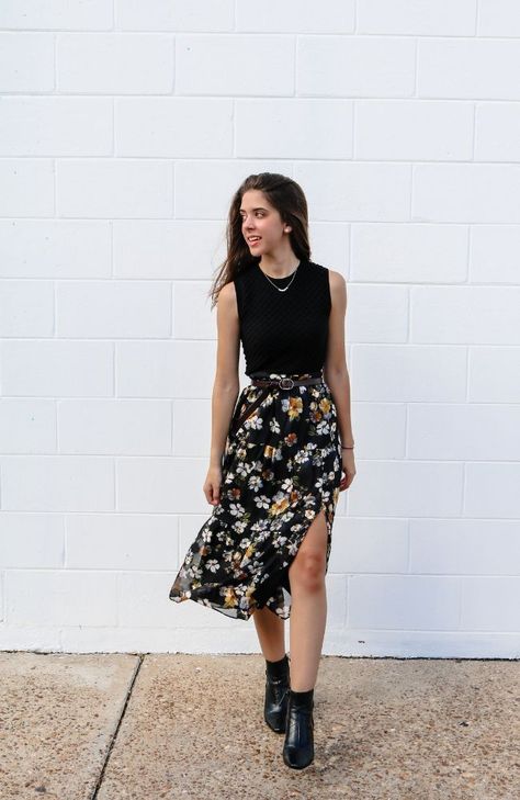 This midi-length skirt combines classic elegance with a vibrant twist. The skirt features a striking black and yellow floral pattern, adding a pop of color and energy to your outfit. The combination of the dark black background and the lively yellow blooms creates a captivating contrast that's both chic and eye-catching. Perfect for a stylish and versatile wardrobe addition. Maxi Skirt Office Outfit Summer, Crew Neck With Skirt, Navy Floral Skirt Outfit, Black With A Pop Of Color Outfits, Tank Top With Skirt Outfit, Casual Spring Skirt Outfits, Floral Black Skirt Outfit, Black Skirt And Black Top Outfit, Black Skirt For Office