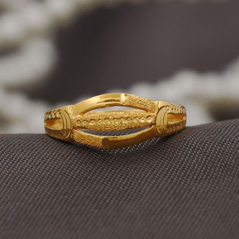 handmade Indian style artisan ring , solid yellow gold Jewelry weight is 2.29 grams approx, 0.7 centimeter wide. Women Gold Rings Indian, Rings For Women Gold Indian, Gold Rings For Women Indian Simple, Women Rings Gold Design, 2 Gram Gold Ring Design For Women, Gold Rings In 2 Grams For Women, Gold Ring For Women, Ladies Rings Gold Design, Om Design Rings For Women Gold