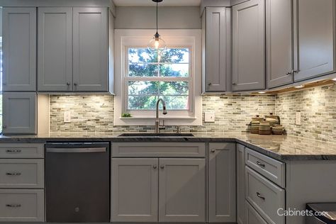 Inviting Oyster Gray Cabinets with Wood Floors and Mosaic Subway Tile - Cabinets.com Wood Cabinets Gray Floor, Kitchens With Gray Stained Cabinets, Light Gray Stained Kitchen Cabinets, Wood Floor Gray Cabinets, Gray Tile Kitchen Floor Wood Cabinets, Discount Cabinets, Warm Wood Flooring, Grey Kitchen Cabinets, Grey Cabinets