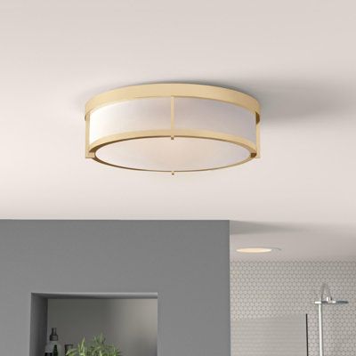 This 3-light flush mount is the ideal lighting solution for lower ceilings. It’s made from polycarbonate and steel with a plastic shade, allowing for stress-free bulb changing. A streamlined cage surrounds the drum-shaped frosted shade, and its neutral finish blends in seamlessly with any decor. This flush mount ceiling light is sloped ceiling adaptable, dimmer switch compatible, and accommodates three 40W bulbs - illuminating any room with added ambiance. Fixture Finish: Satin Brass | Wade Loga Flush Mount Ceiling Lights Bathroom, Hallway Flush Mount Lighting, Flush Mount Ceiling Lights Hallways, Flush Mount Kitchen Lighting, Hallway Light, Basement Lighting, Hallway Light Fixtures, Hall Lighting, Hallway Lighting