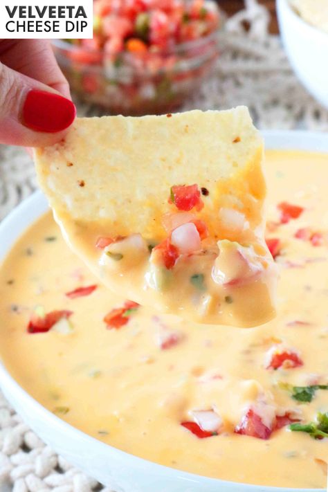 This awesome queso recipe (a.k.a. Mexican Velveeta Cheese Dip) is so easy to make! You can whip it up in the microwave or the crock pot and it is the perfect party appetizer!  It’s just like the cheese dip from your favorite Mexican restaurant…only better! Velveeta Cheese Dip Recipes, Velveeta Dip, Velveeta Cheese Dip, Recipes With Velveeta Cheese, Cheese Dip Crock Pot, Mexican Dip Recipes, Cheese Dip Mexican, Velveeta Recipes, Taco Dip Recipe