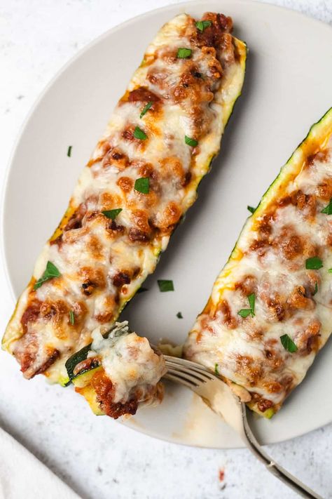 Satisfy your cravings with these beef-stuffed zucchini boats! This easy dinner recipe is healthy, made with less than 10 ingredients, and perfect for a quick, wholesome meal. A flavorful way to enjoy zucchini and beef together for a nutritious dinner idea! Beef Stuffed Zucchini Boats, Zucchini Boats Beef, Beef Zucchini Boats, Beef Zucchini, Stuffed Zucchini Boats, Nutritious Dinner, Stuffed Zucchini, Zucchini Boats, Easy Zucchini