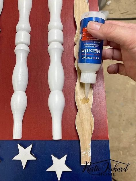 Upcycled spindles make this DIY Patriotic Wood Flag a unique a fun summer décor idea that can be used inside or outside your home. Wood Spindle Crafts Diy Ideas, Upcycled Spindles, Wooden Flags Diy, Wooden Firecrackers, Spindle Crafts, Summer Farmhouse Decor, Peace Garden, Farmhouse Decor On A Budget, Garden Poles