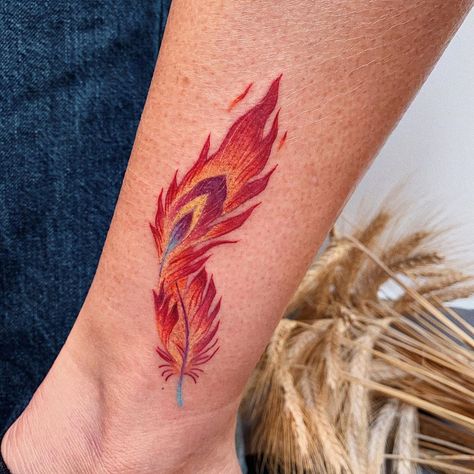 Phoenix Feather Tattoo, Feather Tat, Owl Feather Tattoos, Feather Tattoo Ideas, Phoenix Feather Tattoos, Flute Tattoo, Lisa Tattoo, Rising Phoenix Tattoo, Feather Tattoo Meaning